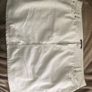 White skirt. Slight discoloration at top on back. See photo.